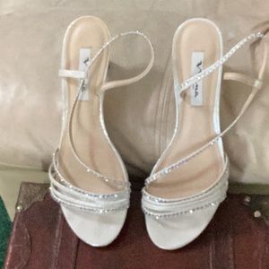 NINA New York, shiny silver, dressy, strappy heels. silver sparkles straps.